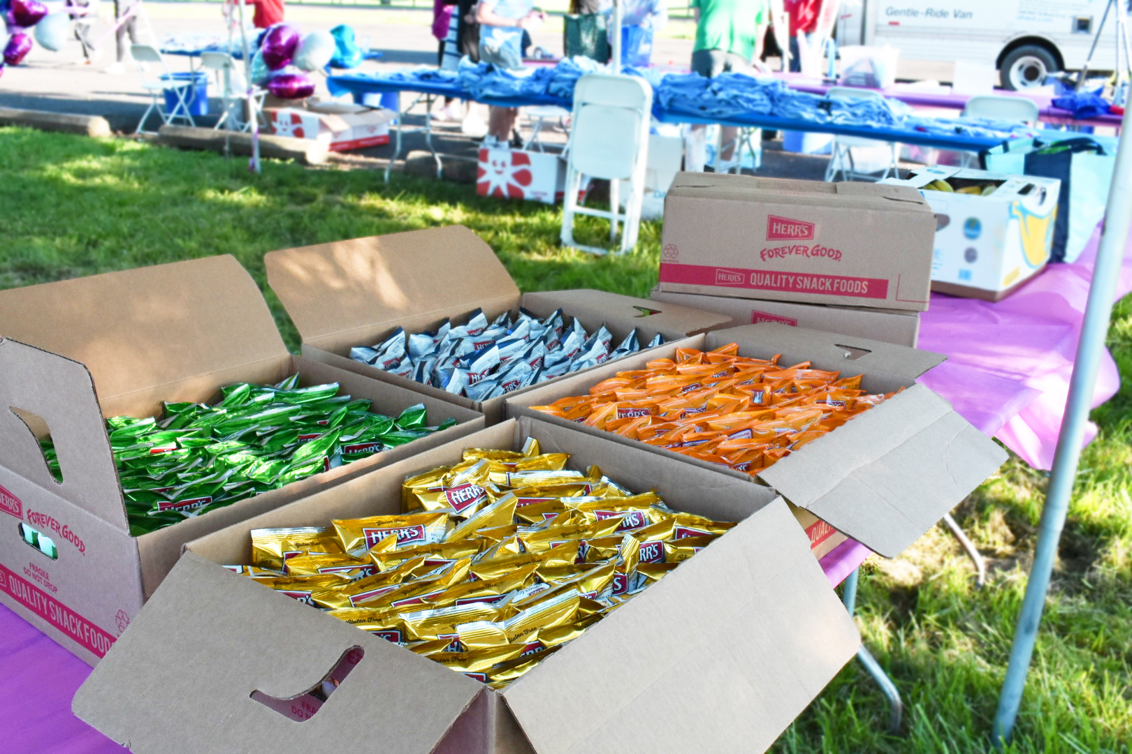 Boxes of Herr's snack products at an event