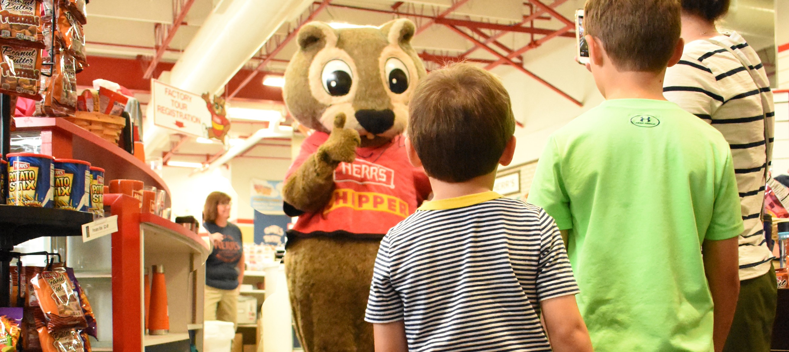 Chipper Giving A Thumbs Up To A Visiting Family
